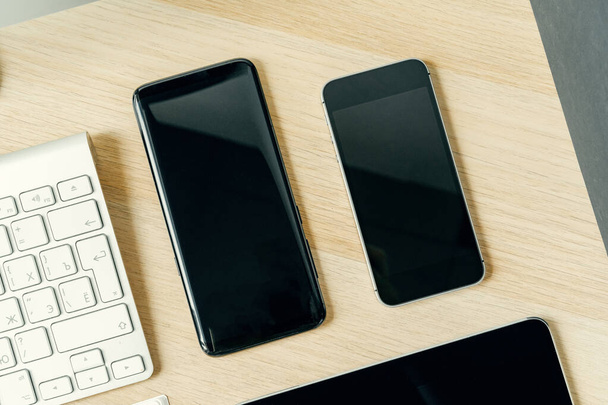 Close up shot of digital devices on office table - Фото, изображение
