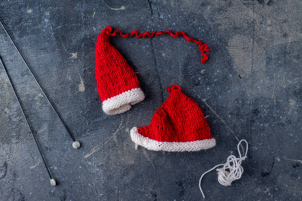 knitting process of Santa Claus hats on a blue background step 3 - Photo, Image