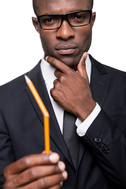 African man in formalwear holding pencil - Fotografie, Obrázek