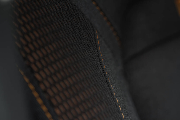 High angle view of modern car fabric seats. Close-up car seat texture and interior details. Detailed image of a car pleats stitch work. - Foto, afbeelding