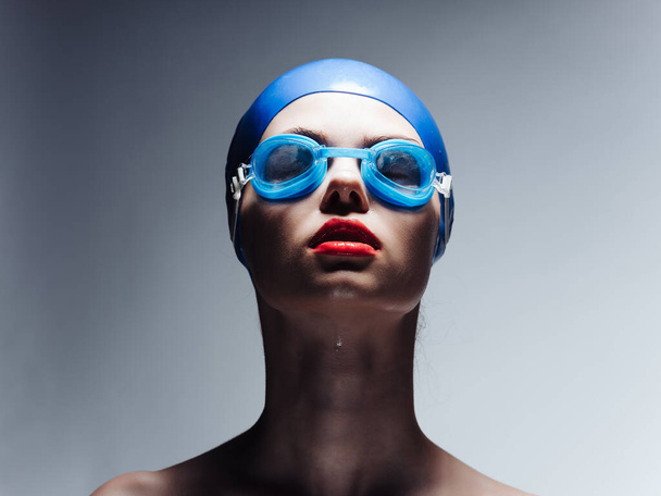 athletic woman in a swimming cap workout Studio - Photo, Image