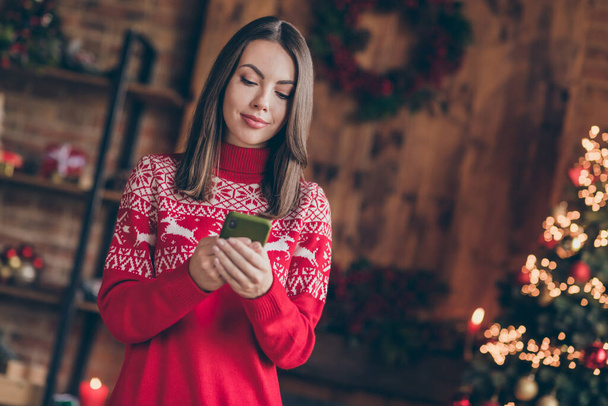 Photo of shiny sweet lady wear red pullover smiling sending modern device christmas congratulations indoors house home room - Fotoğraf, Görsel