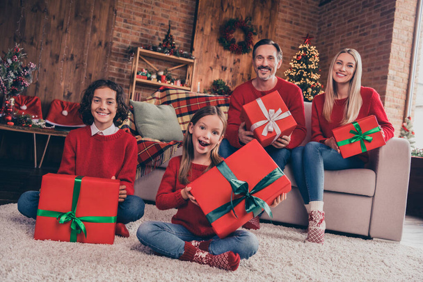 Portrait of beautiful handsome cheerful family congrats holding giftboxes advent eve spirit at decorated loft home indoors - 写真・画像