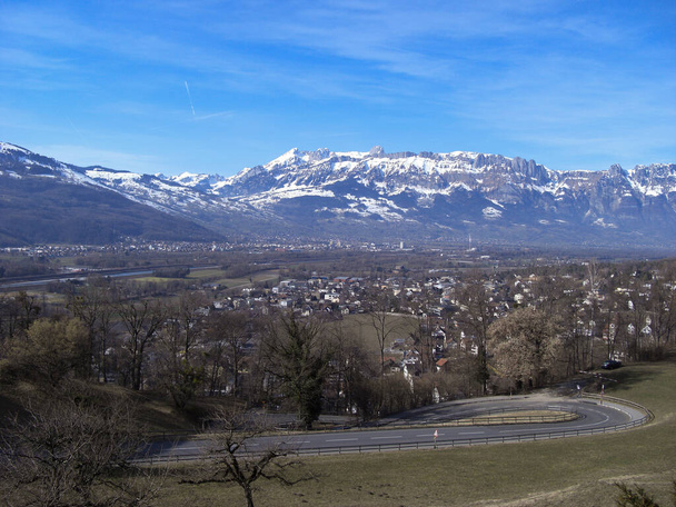 Vaduz, Liechtenstein, February 26, 2019 Panoramic view over the majestic mountains on the swiss side - Photo, Image
