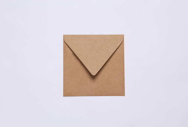 Craft envelopes on white background. Top view - Foto, afbeelding