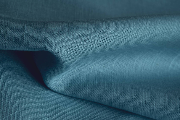 Linen fabric, blue background. Soft linen blue fabric texture. Textured fabric background. Macro with shallow dof - Photo, Image