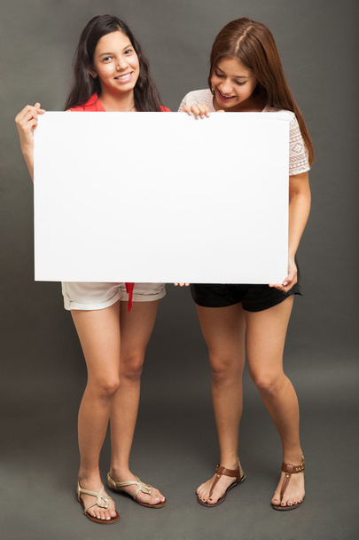 Friends holding a white sign - Photo, Image