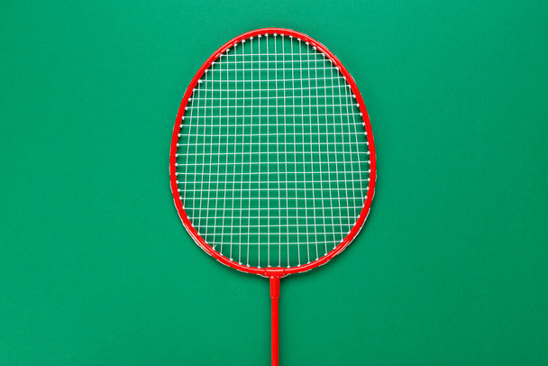 Badminton racket on a green background. Concept summer relaxation. Space for text. - 写真・画像