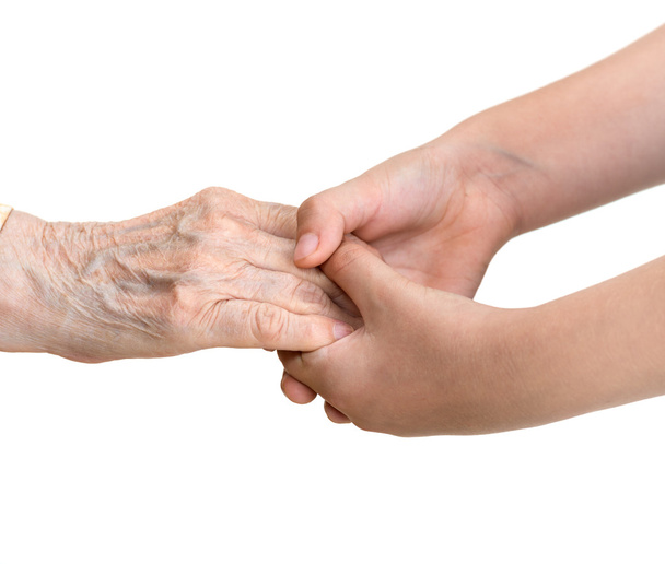 stará žena a mladá dívka drží za ruce - Fotografie, Obrázek