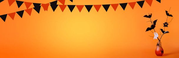 Halloween background with a red bottle in the form of a lamp, bats, spiders, ghosts, a garland in the form of black and orange flags on an orange background.Trick or treat. Banner. Copy space for text - Foto, Imagen