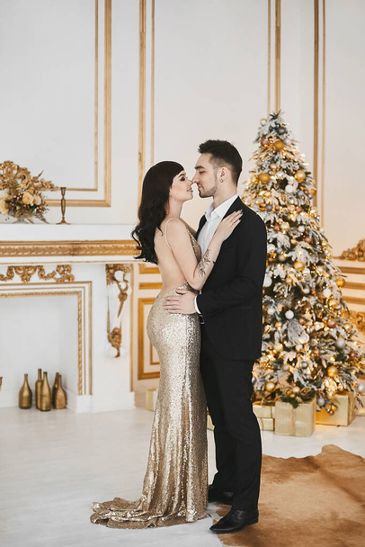 Shot of a young happy couple in love celebrating Christmas. Holidays and celebration concept - Фото, изображение
