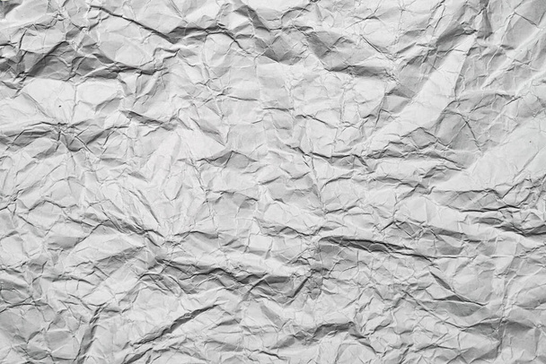 Starý zmačkaný šedý grafitový papír pozadí, prázdné s kopírovacím prostorem, zvlněné vrásčité pozadí. - Fotografie, Obrázek