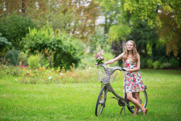 Happy girl with bicycle - Photo, Image