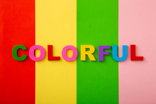 Bright multicolored alphabet with colorful wording background. Flat Lay - Φωτογραφία, εικόνα