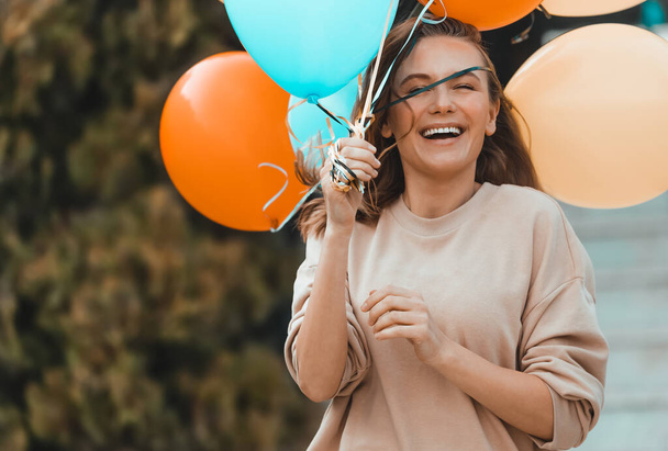 Birthday Girl with Colorful Balloons Outdoors - Foto, Bild