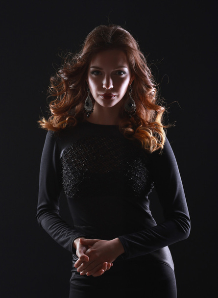 Portrait of beautiful brunette woman in black dress. - Foto, imagen