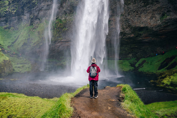 Seljalandsfoss, a beautifull and touristic waterfall in southern Iceland. High quality photo - 写真・画像