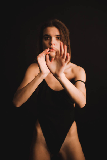 emotional portrait of a girl in the studio, a woman expresses difficult emotions on camera, a woman's mood in close-up. soft focus blurry and fuzzy background in portrait - Φωτογραφία, εικόνα