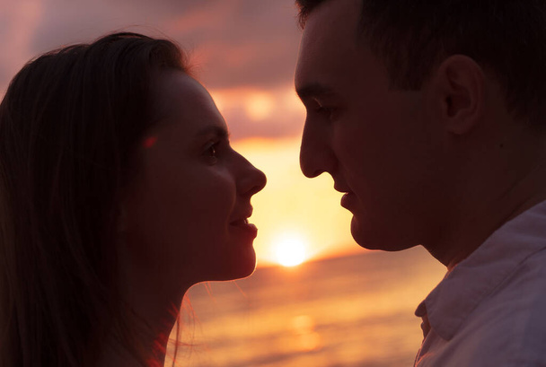 Romantic sensual young couple in love at the sunset - Photo, Image