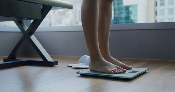 Woman on scales measure weight - Photo, Image