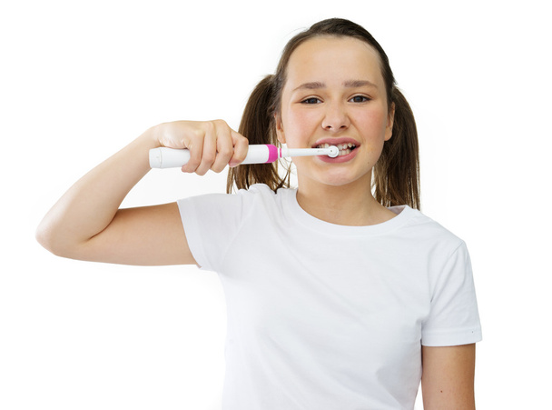 Healthy cute girl brushing her front teeth - Zdjęcie, obraz