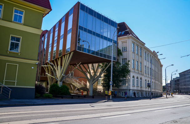 TALLINN, ESTONIA - JULY 21, 2014: Modern architecture (a building on stilts) in the street of historical center of Tallinn, Estonia - Zdjęcie, obraz