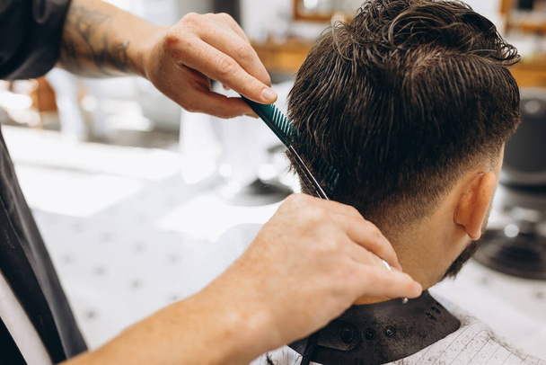 Professional barber at work process. Beauty, selfcare, style, fashion, healthcare and male cosmetics concept. - Φωτογραφία, εικόνα