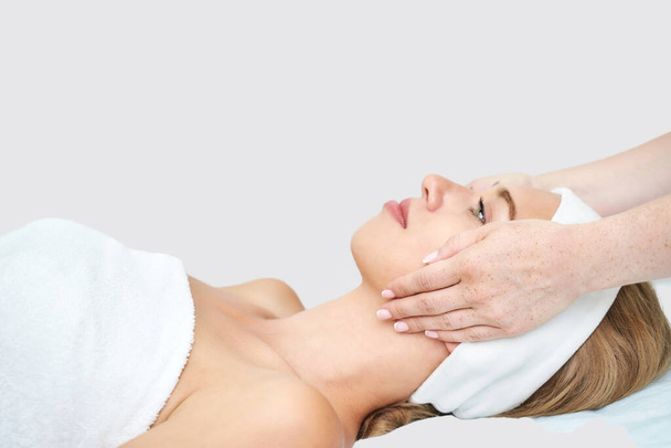 Face massage at spa salon. Doctor hands. Closeup view. High quality photo - Foto, Imagen