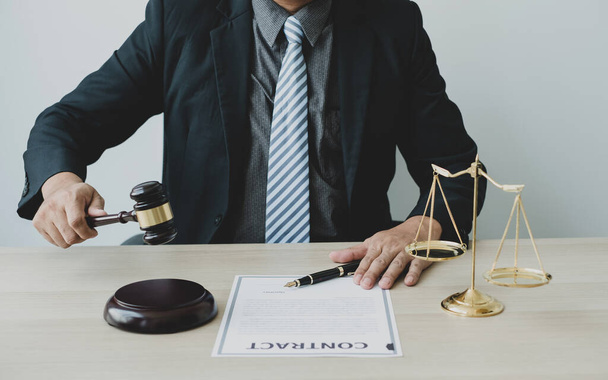 Professional man lawyers work at a law office There are scales, Scales of justice, judges gavel, and litigation documents. Concepts of law and justice. - Foto, Imagen