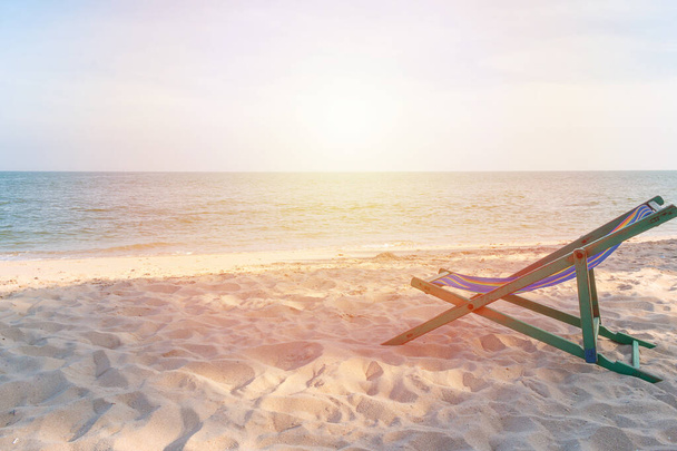 empty wooden beach chair at the beach background - Foto, Imagen