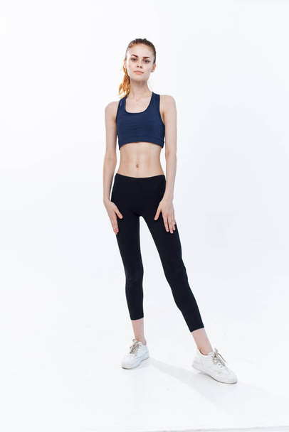 cheerful sportive woman with her leg raised workout lifestyle jumping - 写真・画像