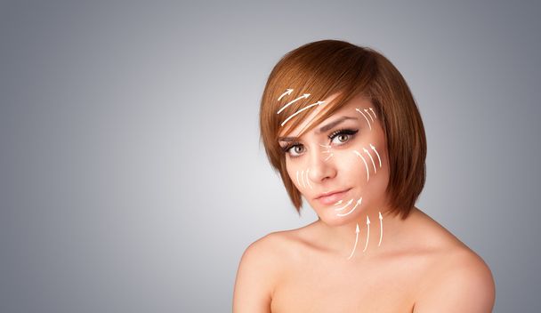 Beautiful girl with facial arrows on her skin - Foto, Imagen
