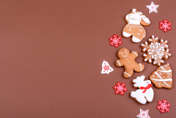 Christmas festive ginger gingerbread made at home on a color background. Preparations for the New Year and Christmas - 写真・画像