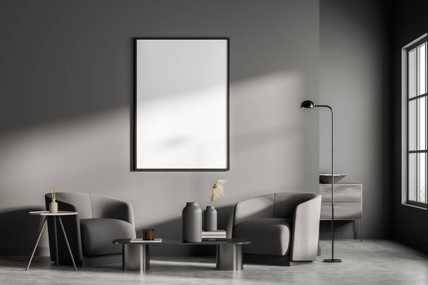 Empty frame on dark grey wall of living room interior with concrete flooring and on trend lamp with two coffee tables in seating area. Concept of modern artwork. Mockup for your design. 3d rendering - Foto, afbeelding