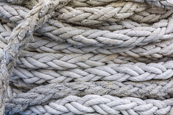 Textured surface of gray mooring rope made from natural fibers - Foto, afbeelding