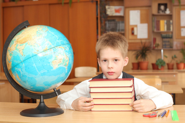 Boy reading book in the classroom - Photo, Image