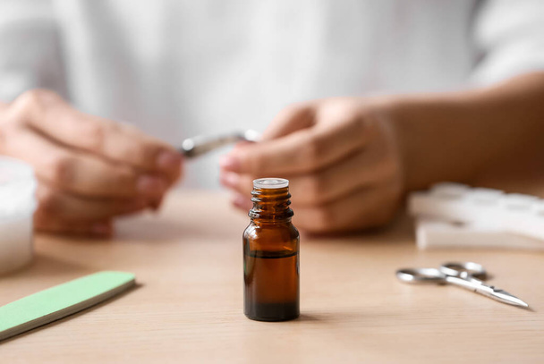 Bottle of essential oil on table in manicure salon - Foto, Bild