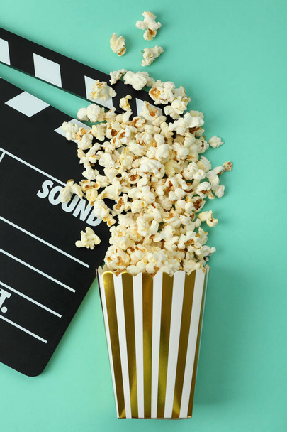 Clapperboard and paper box with popcorn - Photo, Image