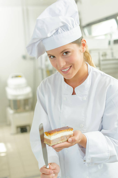 a young woman presenting pastry - Foto, Imagem