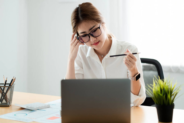 Woman accountant working financial inspector and secretary making report calculating balance. Internal Revenue Service checking document. Audit concept - Photo, Image