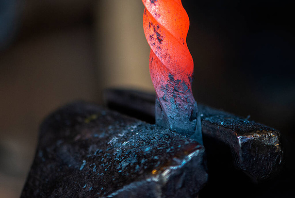 Close-up of hot metal on anvil in blacksmith workshop - Photo, Image