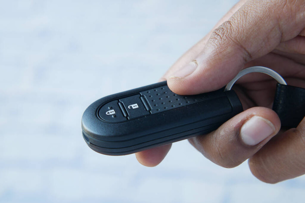 close up of hand hold car key on white background , - Photo, Image