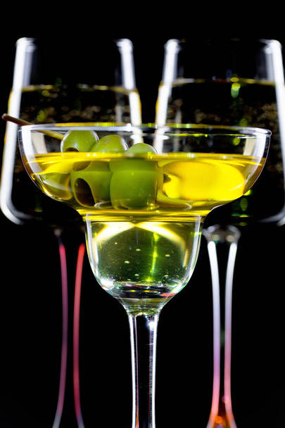 Glasses of wine on a black background. - Фото, изображение