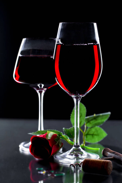 Glasses of wine on a black background. - Photo, image