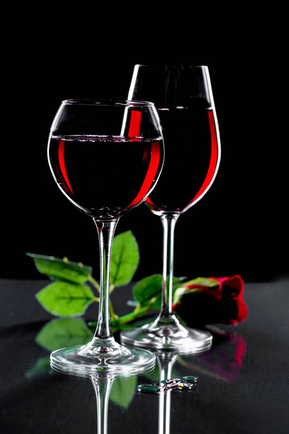 Glasses of wine on a black background. - Photo, image
