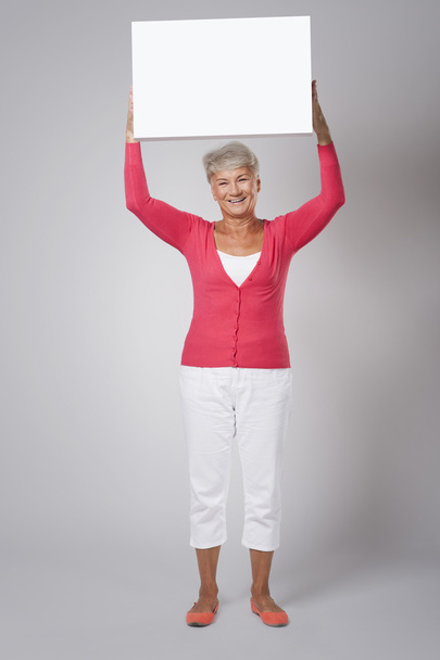 Femme âgée avec tableau blanc
 - Photo, image