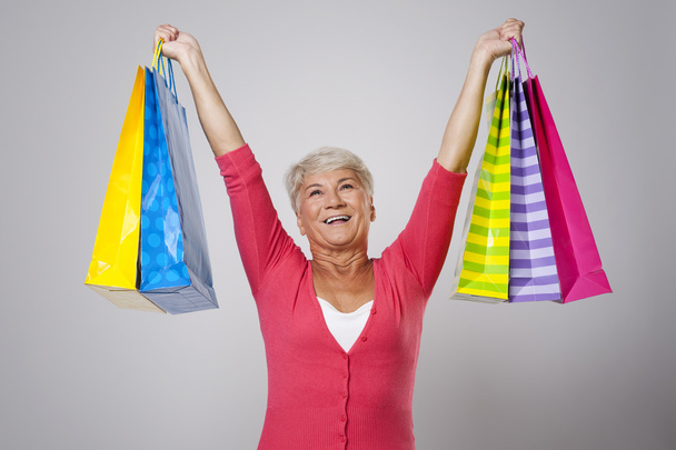 Senior woman with shopping bags - Fotó, kép