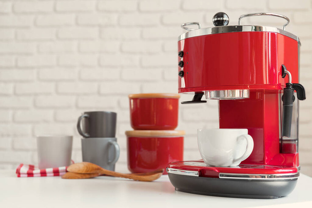 Modern kitchen. Red retro style coffee machine close up - Photo, Image