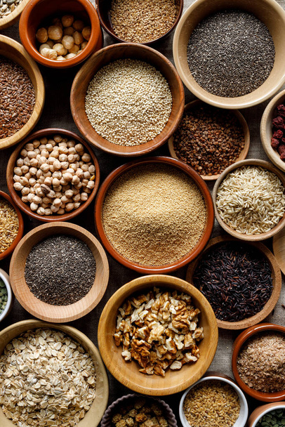 A healthy food mix of grains, groats and nuts, top view. Concept of healthy eating - 写真・画像