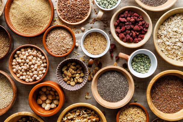 A healthy food mix of grains, groats, dried fruits and nuts, close up view. Super food  - Photo, Image
